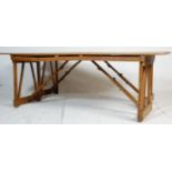 A pair of two mid 20th century vintage retro industrial folding trestle tables - refectory dining