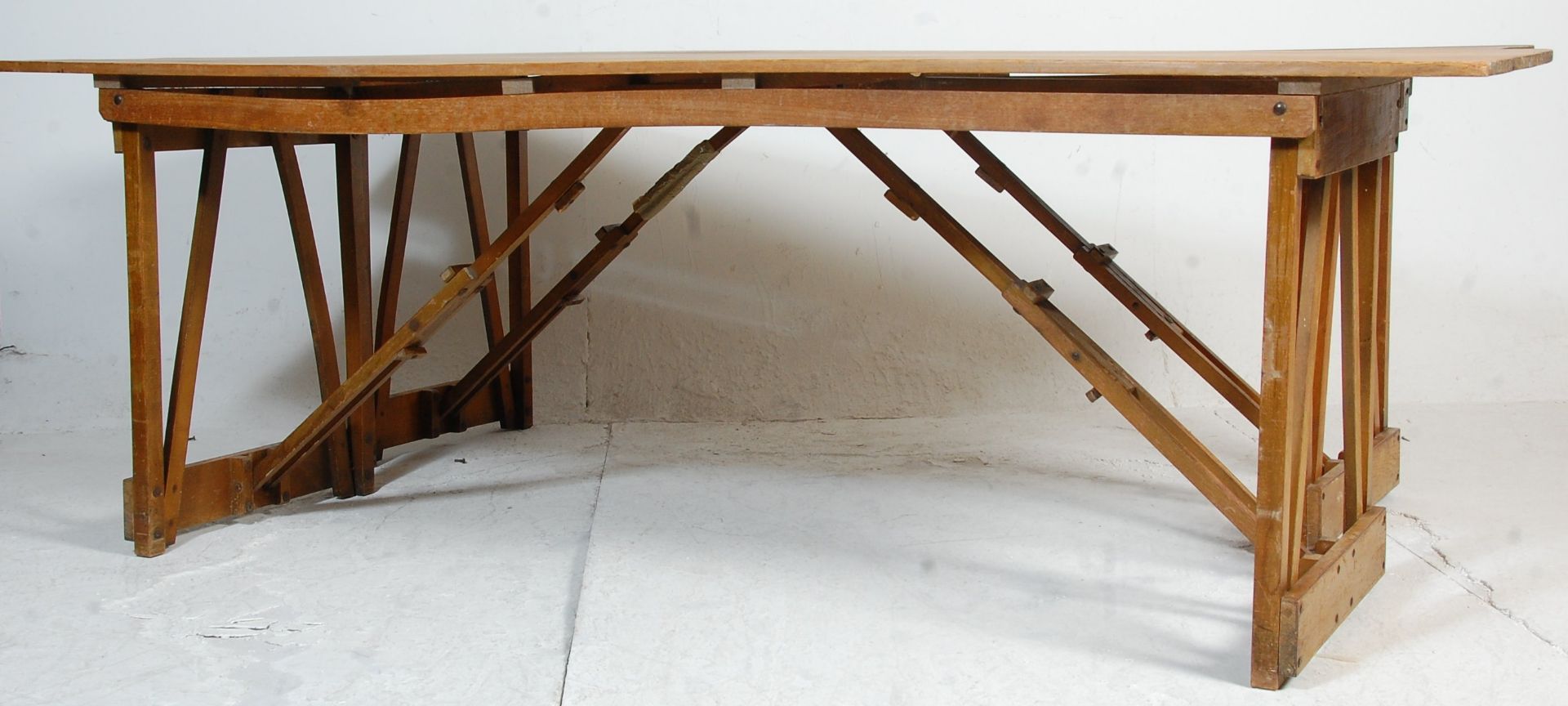 A pair of two mid 20th century vintage retro industrial folding trestle tables - refectory dining