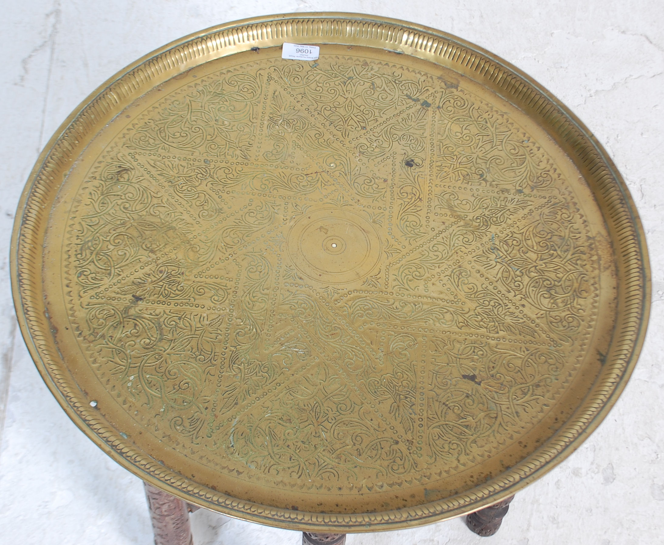 A 20th century brass top Moorish / Binares traders table having a brass chase decorated top with - Image 2 of 3