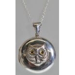 A stamped 925 silver pendant necklace having a fine link chain with a round pendant having an