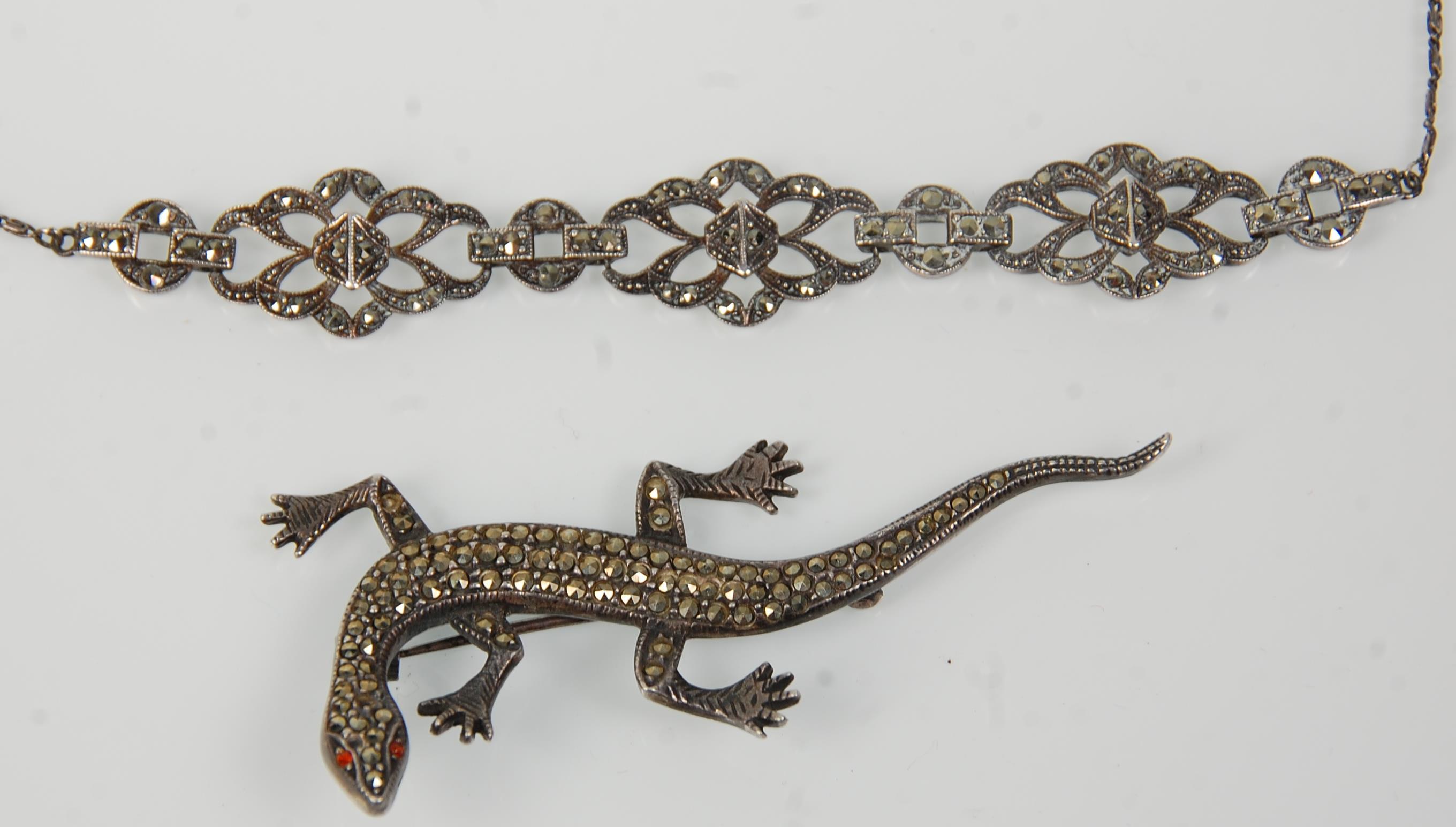 A 1920's Art Deco silver collar necklace being set with marcasites together with a silver brooch