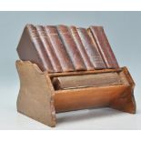 An early 20th Century oak Asprey's  of London small book shelf / book stand complete with a