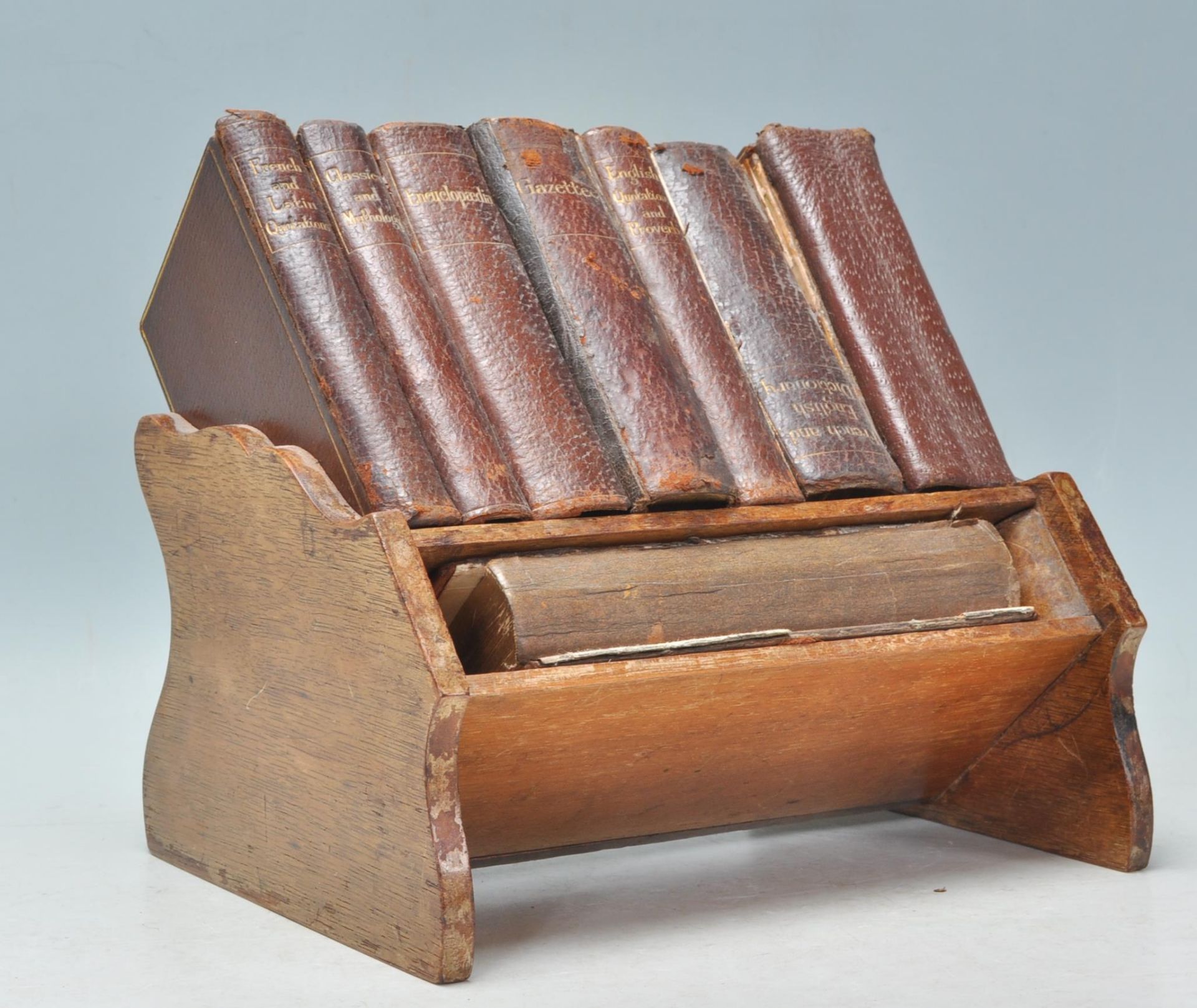 An early 20th Century oak Asprey's  of London small book shelf / book stand complete with a