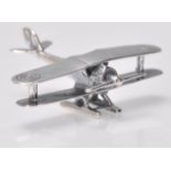 A stamped 925 silver figurine in the form of a biplane with targets to the wings. Weight 7.8g.