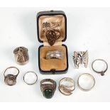 A group of ten silver ladies rings to include a butterfly ring and another decorative claw ring,