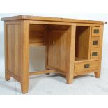 A contemporary chunky oak furniture land inspired golden oak desk having an open kneehole recess