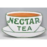 A vintage enamel advertising sign for 'Nectar Tea' in the form of a teacup and saucer. 32cm x 53cm.