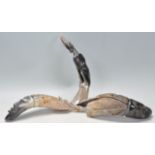 A good group of three retro 20th Century carved horn figures one in the form of an Antelope and