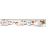 A collection of various vintage 20th Century bone china tea cups and saucers to include Royal Albert