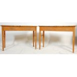 A pair of retro mid century, circa 1950's school desks. Each raised on squared legs with returns