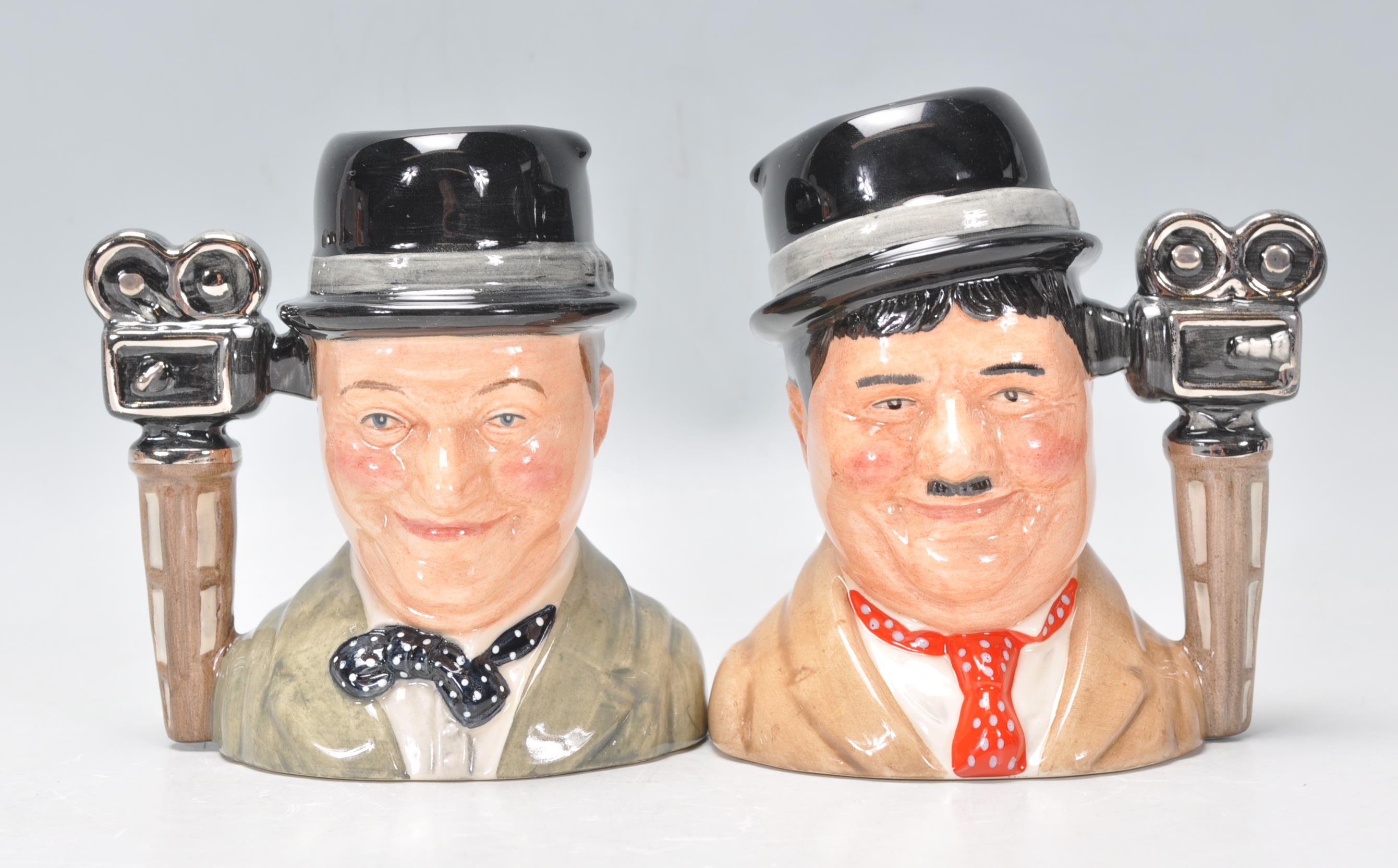 Laurel & Hardy - Two Royal Doulton ceramic Character / Toby jugs one of Stan Laurel D7008 and Oliver