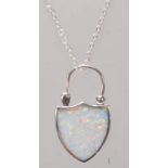 A stamped 925 silver pendant necklace having a shield design lock pendant set with an opal panel.