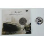 A commemorative 2012 Titanic £5 coin together with a silver proof 2012 R.M.S Titanic coin. Weighs