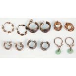A group of six pairs of silver earrings to include a pair of crinkled hoop examples, a pair set with