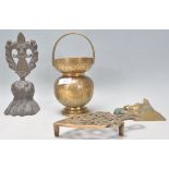 A collection of brass wares to include an antique lions paw and crest door stop, Indian brass vessel