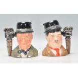 Laurel & Hardy - Two Royal Doulton ceramic Character / Toby jugs one of Stan Laurel D7008 and Oliver