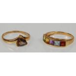 Two hallmarked 9ct yellow gold ladies rings. One set with five multi coloured stones to a pierced