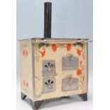 A vintage 20th Century tin model of a stove / oven