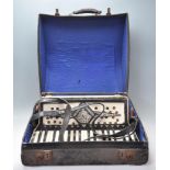 A vintage 1930's Italian Geraldo Standard accordion having a celluloid case having 34 black and