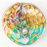A stamped 925 silver brooch in the form of an owl clasping a pearl with coloured plique a jour