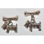 A pair of stamped 925 silver cufflinks in the form of Scottish terriers with bone toggles. Weight