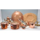 A collection of copper kitchen wares to include Jean Matillon copper saucepans, copper colander, ice