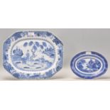 An 18th Century Chinese blue and white platter of octagonal form having a central hand painted scene