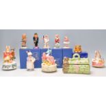 A mixed group of mostly ceramic figures a Beswick Mrs Rabbit Baking ECF 7 and other Beatrix Potter