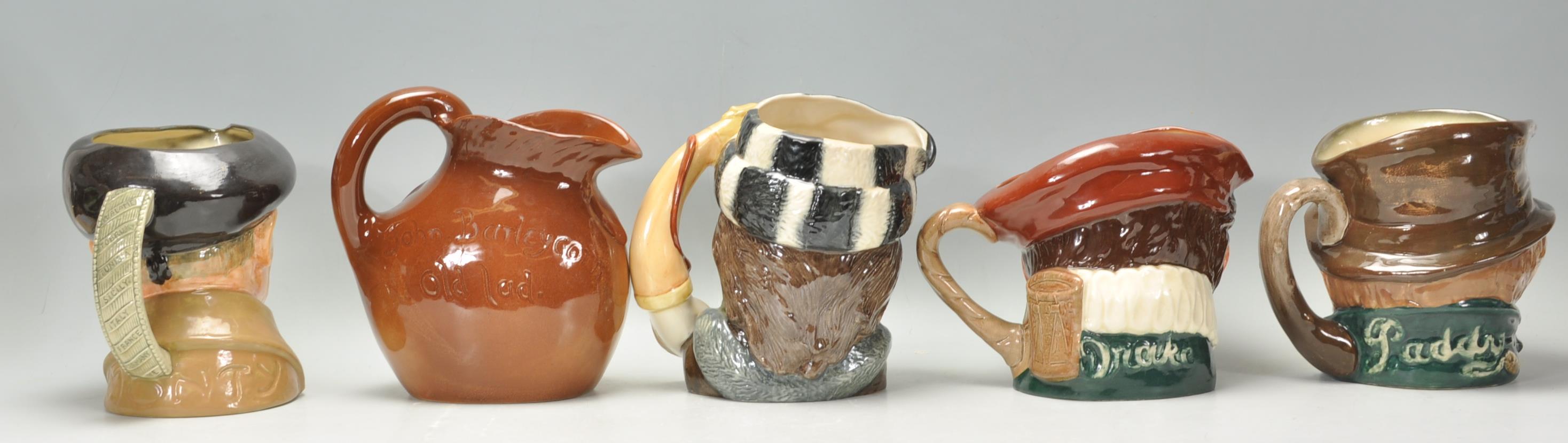 A group of five Royal Doulton character jugs to include The Trapper D6609, Monty D6202, Paddy, and - Image 3 of 10