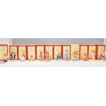 A group of twelve Royal Doulton Bunnykins ceramic figurines to include Rainy Day DB 147, Lawyer