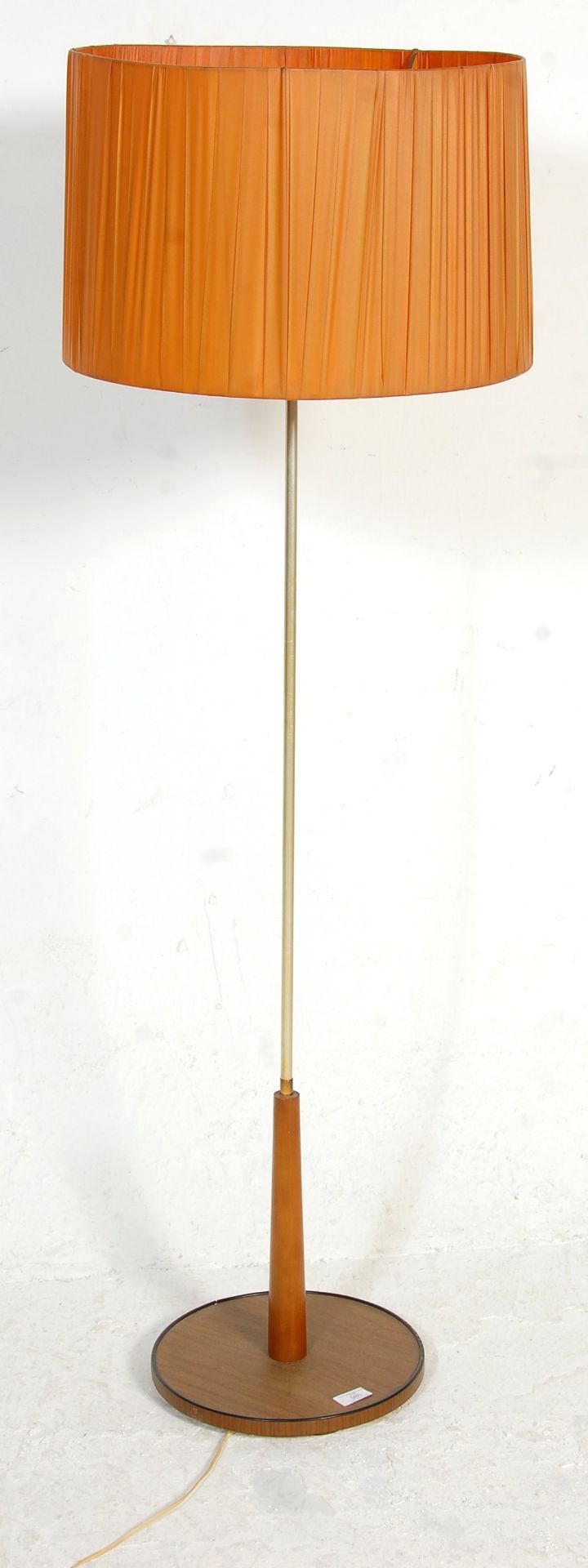 A vintage retro 1970's standard lamp having a round dark wood base with a chromed column with an