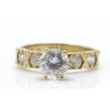 A 9ct gold and CZ solitaire ring. The ring with large round cut cz in prong setting with further