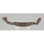 A thick and heavy English silver hallmarked gentlemens flat link identity bracelet having an