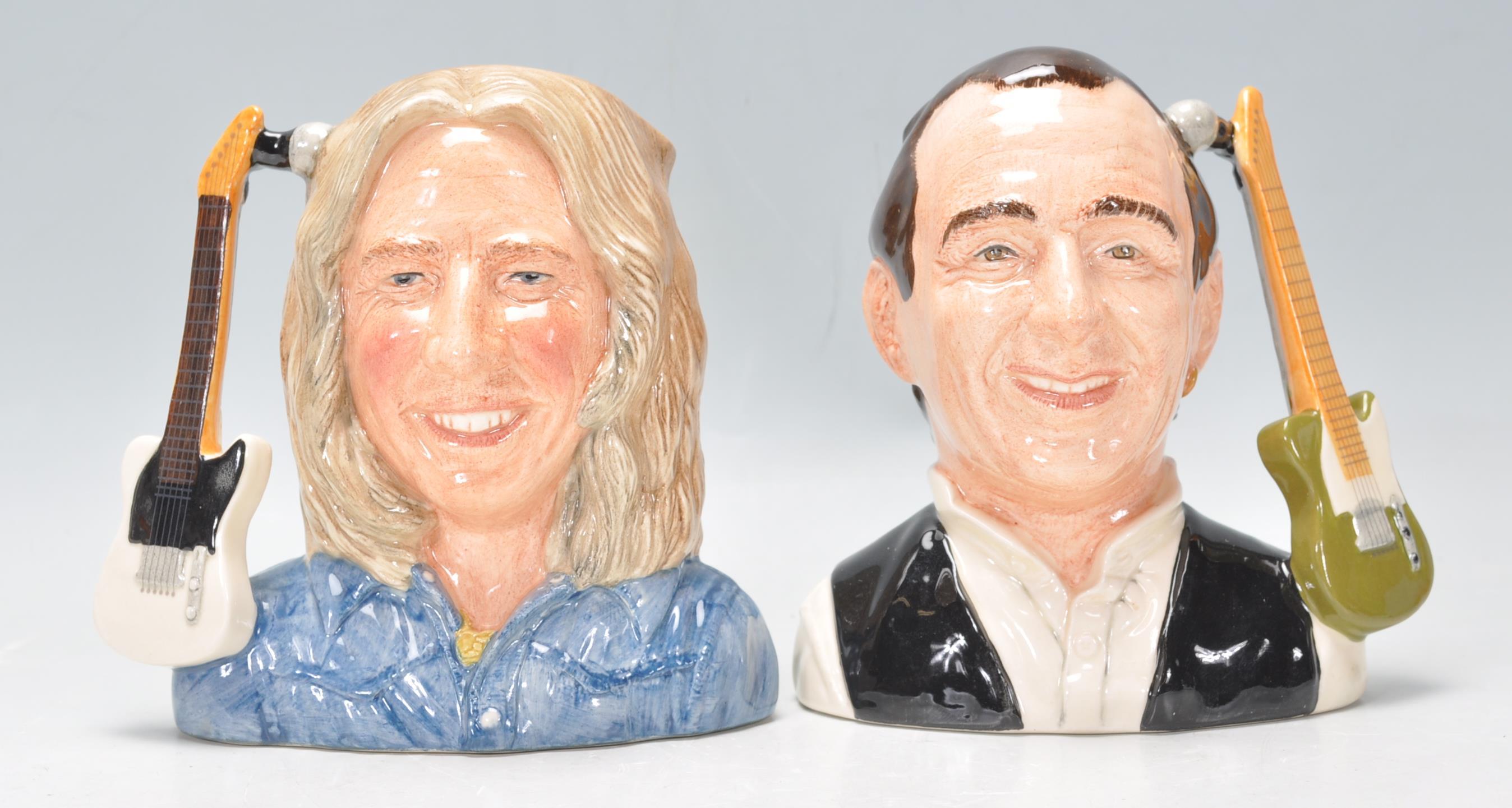 A pair of Royal Doulton Status Quo character jugs to include Rick Parfitt D6962, Francis Rossi