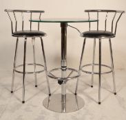 A 20th Century glass topped bistro style table hav