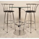 A 20th Century glass topped bistro style table hav