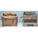 A vintage 20th Century Hohner made accordion havin