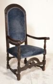 A 17th century oak armchair. Raised on block and t