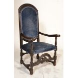 A 17th century oak armchair. Raised on block and t