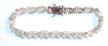 A stamped 925 silver tennis bracelet set with squa