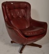 A retro mid century swivel egg chair  having a 4 p