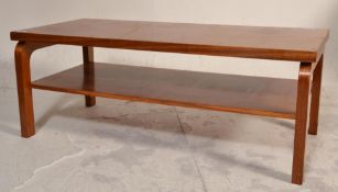 A vintage retro teak wood coffee table of rectangu