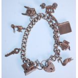 A silver charm bracelet with a heart lock adorned