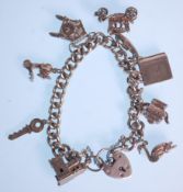 A silver charm bracelet with a heart lock adorned