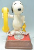 A vintage 1970's novelty Snoopy telephone having a