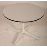 A retro mid 20th Century circular white melamine t