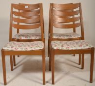 A set of 4 Danish teak wood dining chairs having t