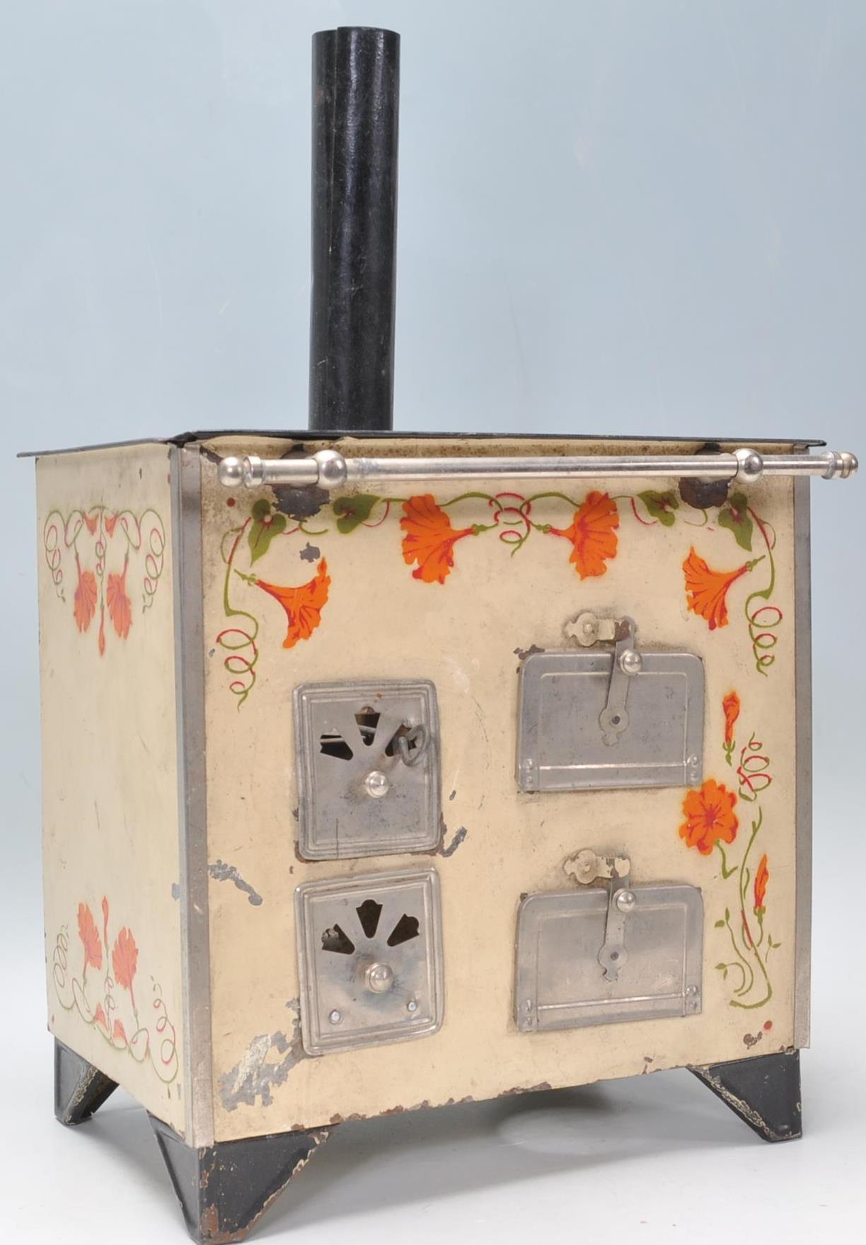 A vintage 20th Century tin model of a stove / oven