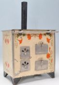 A vintage 20th Century tin model of a stove / oven