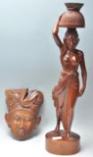 To carved wooden Balinese figures to include a wal